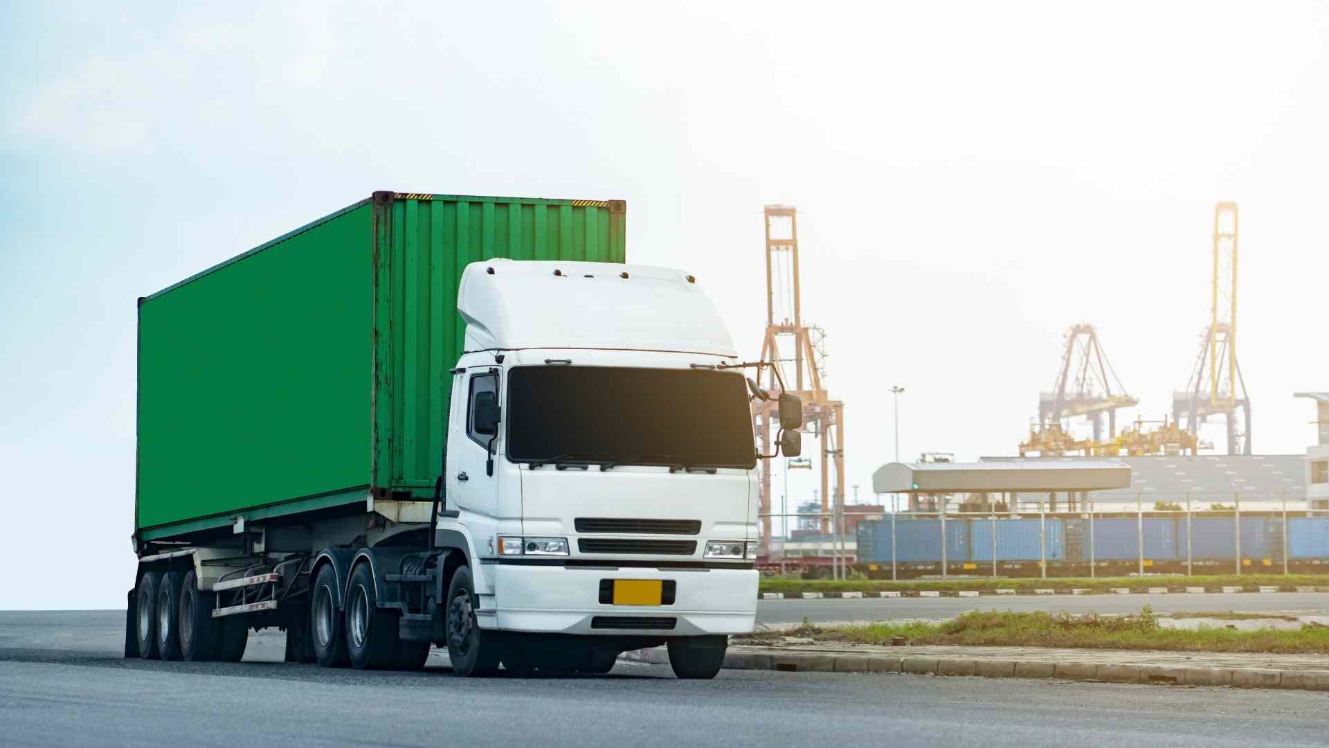 white truck with green container