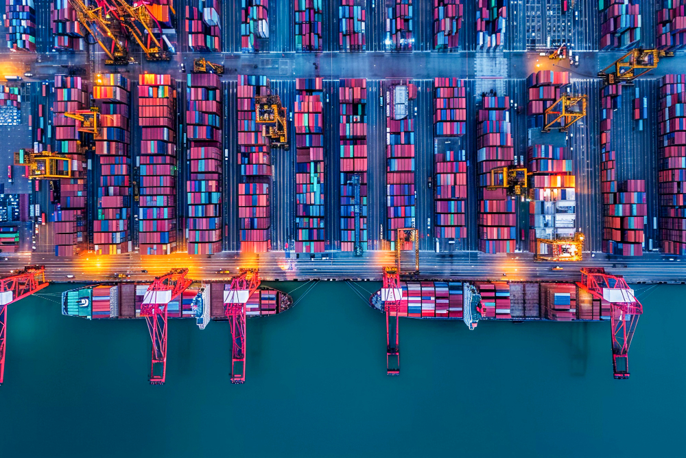 An aerial view of a shipping port with cargo containers.
