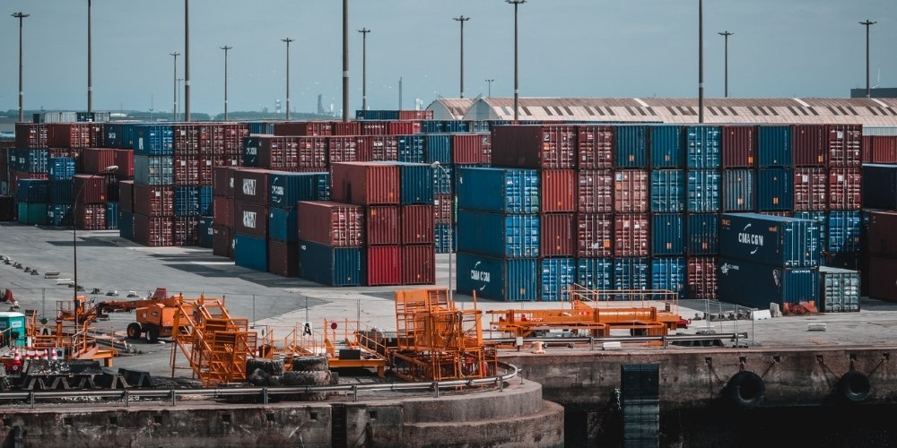 stacks of colorful blue and red shipping containers