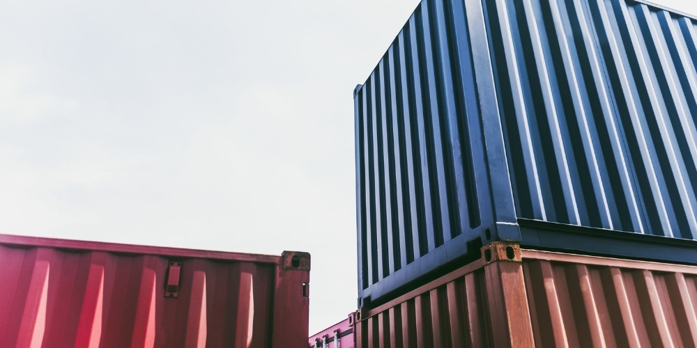 several industrial shipping containers stacked together